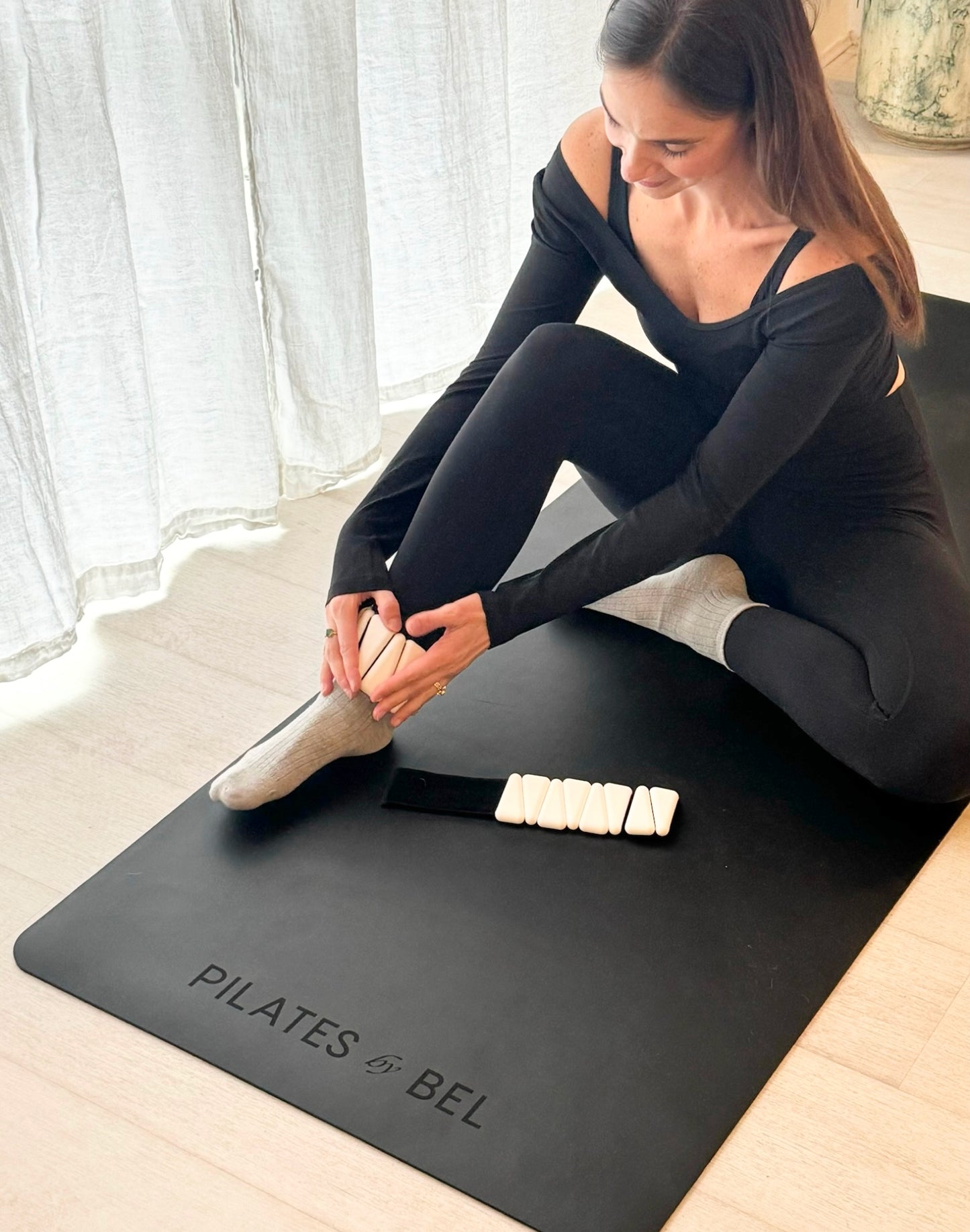 Pilates by bel white leg weights in pilates session